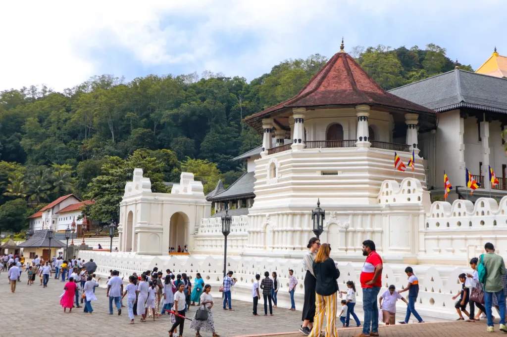 A view of the Temple of the Sacred Tooth Relic in Kandy, Sri Lanka, with its striking white facade and traditional Sri Lankan architecture. A must-see site for anyone exploring what to do in Kandy.