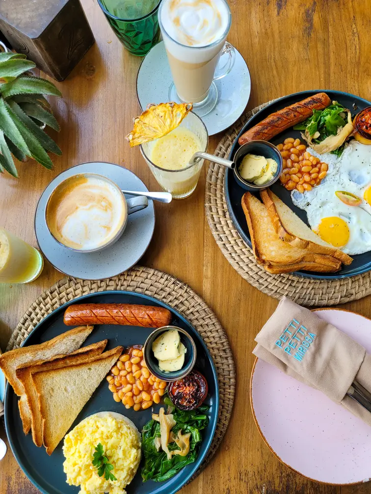 A hearty Western-style breakfast spread with coffee and juice at Petti Petti in Mirissa—foodie-friendly places to visit in Mirissa for a morning bite.