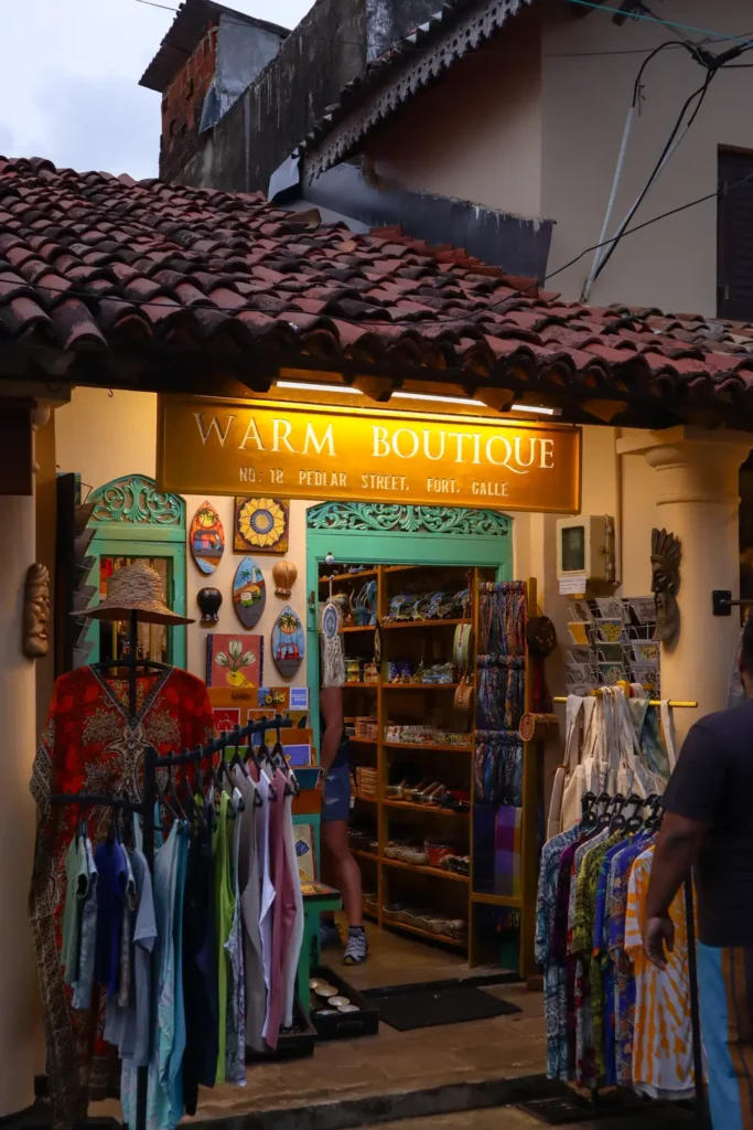 The vibrant display of clothing and souvenirs at Warm Boutique on Pedlar Street, a favorite stop for shoppers looking for things to do in Galle.