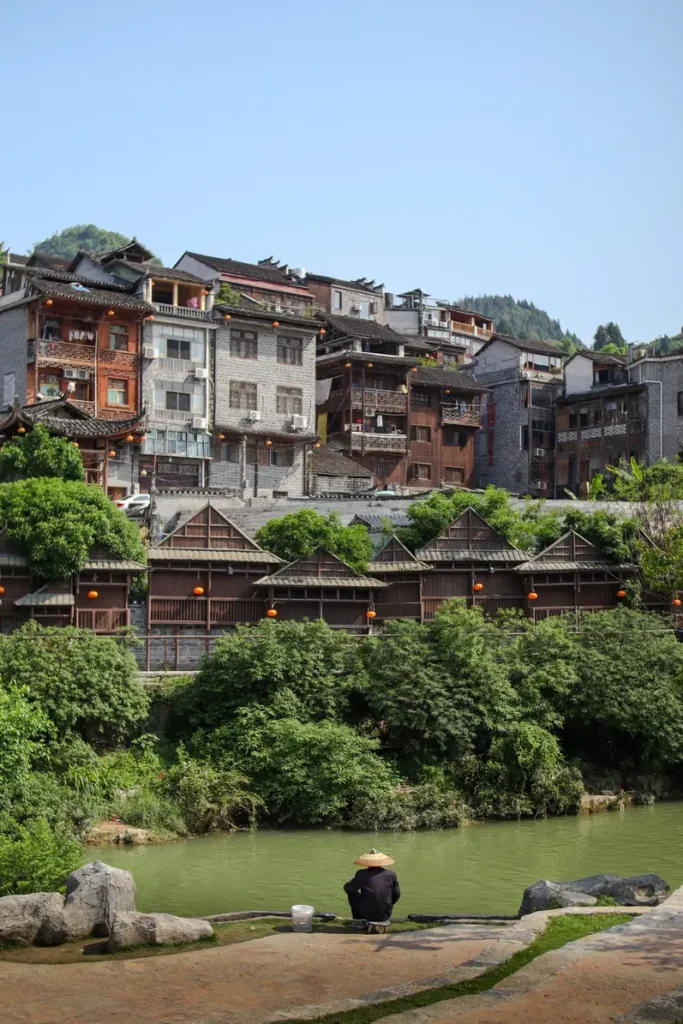 What to do in Furong Ancient Town Man next to the river
