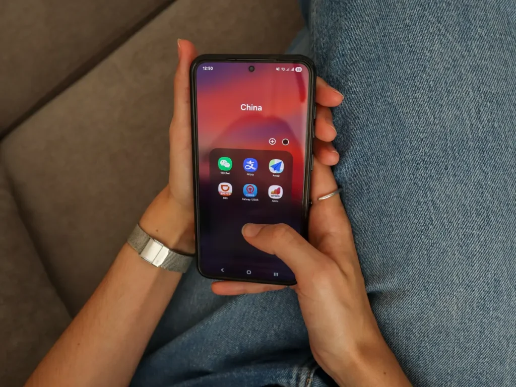 9 Essential Apps you need in China in 2026 1 Home screen folder labeled “China” containing essential apps like WeChat, Alipay, Amap, Didi, Railway 12306, and Airalo. A snapshot of top apps you need in China for communication, transport, and travel logistics.