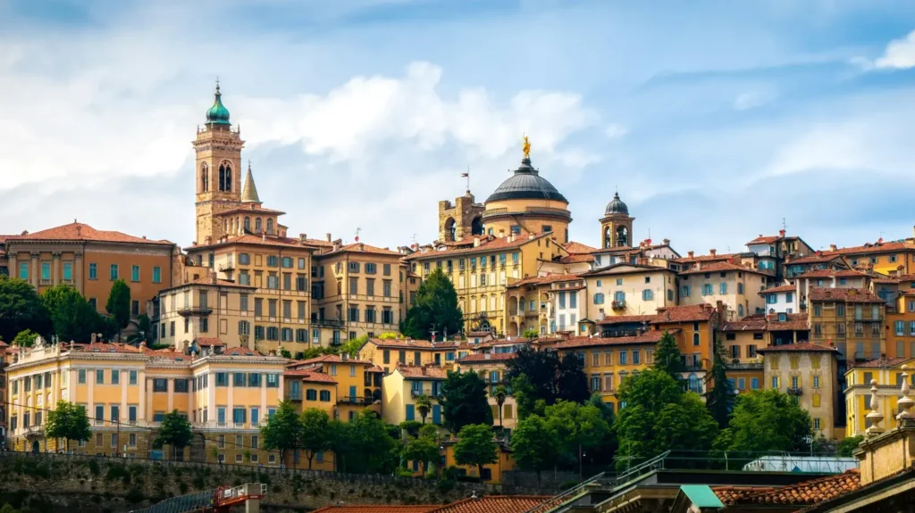 21 beautiful places to visit in Northern Italy that will steal your heart 13 Panoramic view of Bergamo’s Città Alta with its medieval towers and domed churches, highlighting why it ranks among the best cities in Northern Italy.