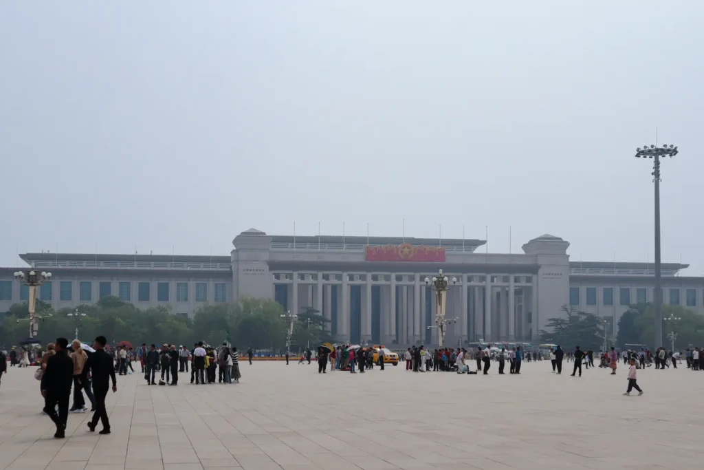 China Travel Tips: 35+ must-know things before visiting (2026 Guide) 25 Visitors gather in front of the National Museum of China on a hazy day at Tiananmen Square.