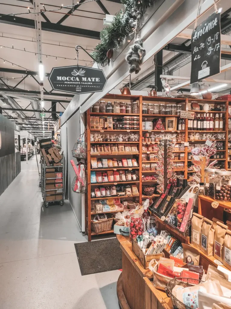 Where to stay in Helsinki: the best neighborhoods & hotels 9 Charming chocolate and coffee shop called Mocca Mate inside a Helsinki market hall, surrounded by shelves of treats and Finnish goodies.